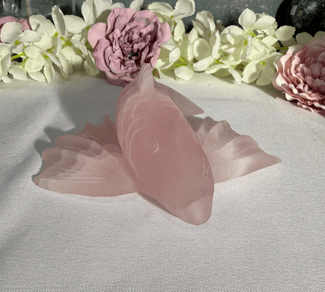 Hand carved rose quartz koi carp 
