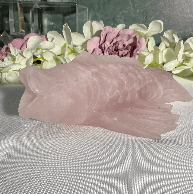 Hand carved rose quartz koi carp